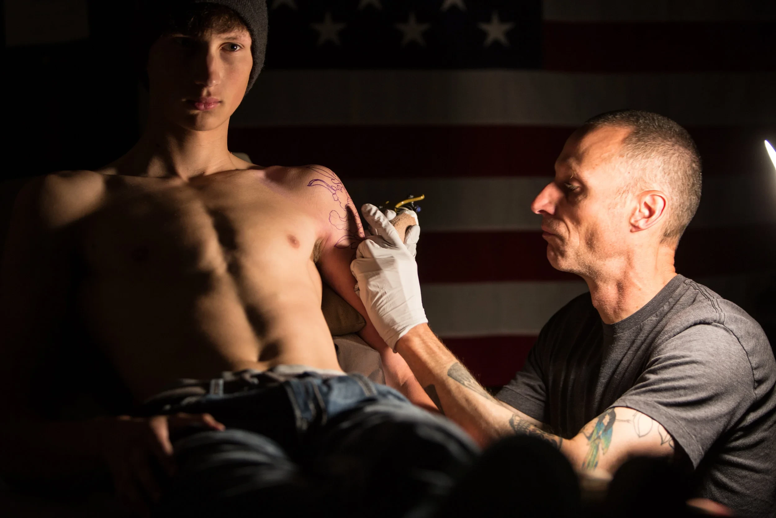 Roger Sparks designing a new tattoo.