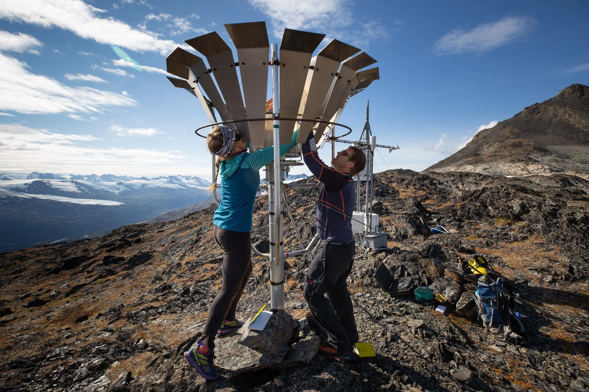 Alaskan scientists working on a remote weather station.