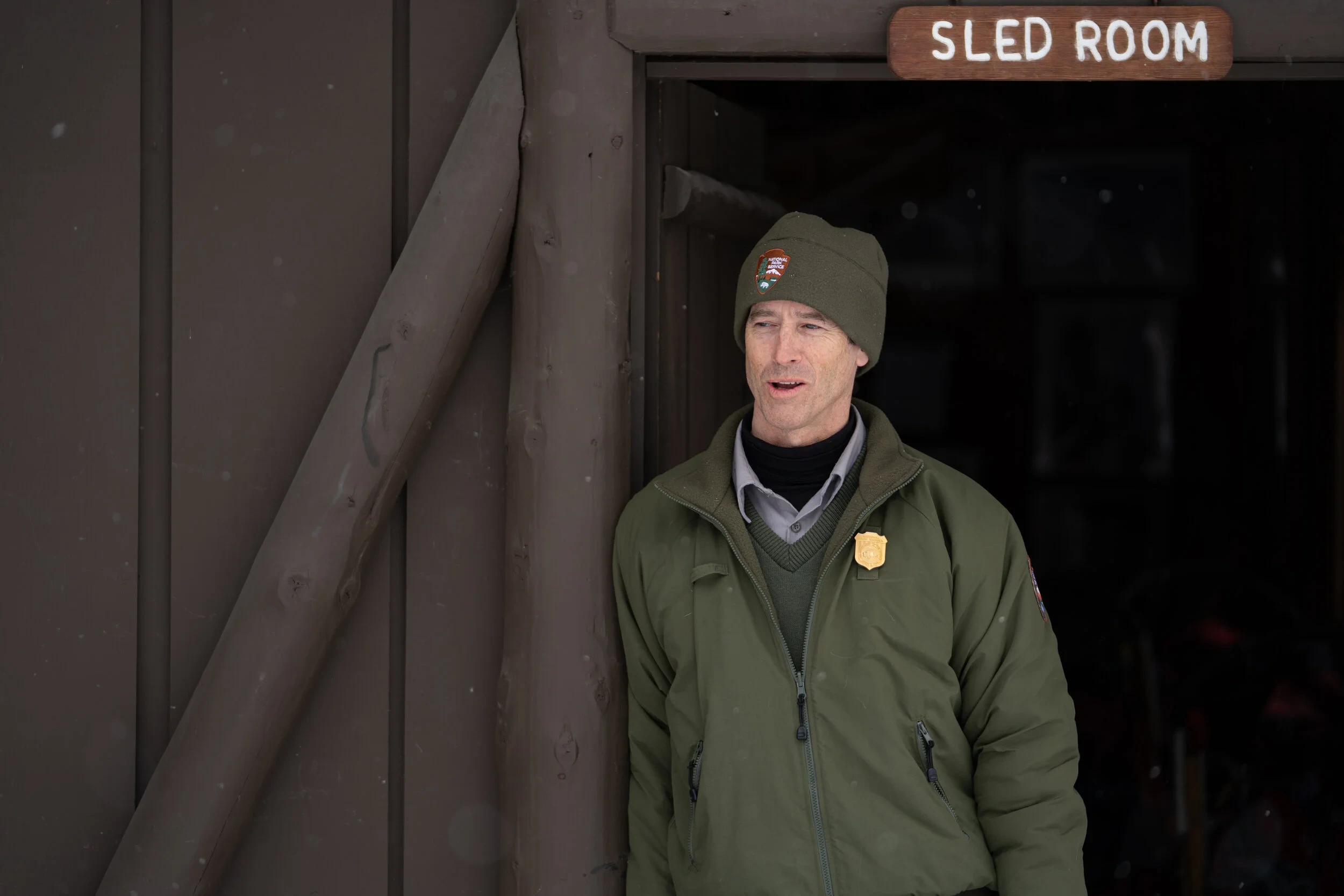 Park Ranger David Tomeo stands outside Denali kennel.