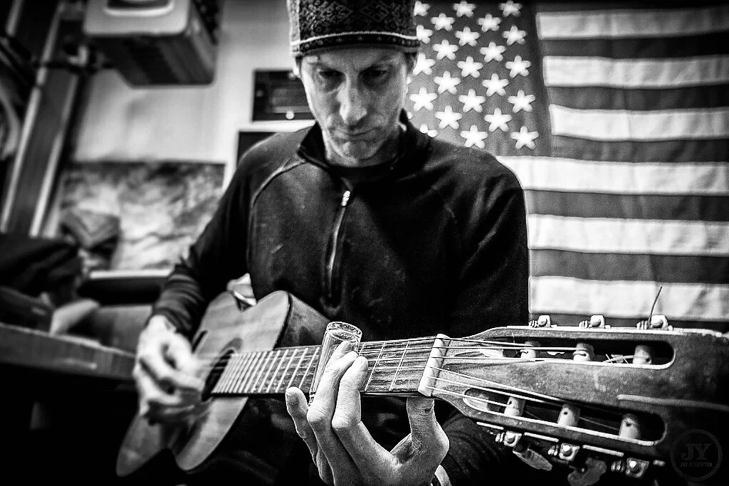 Roger Sparks playing a blues guitar.