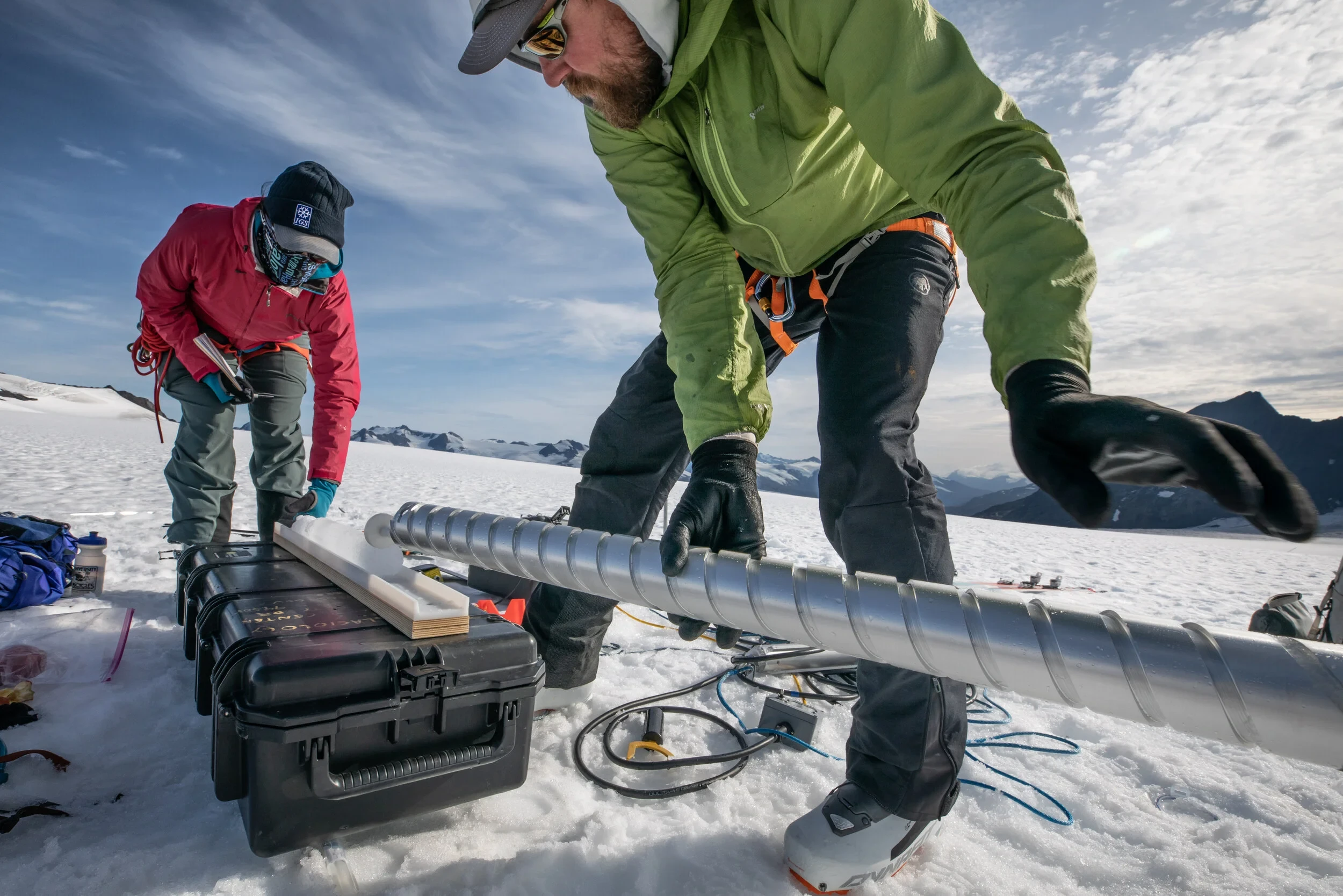 USGS scientists drilling cores on Wolverine Glacier.