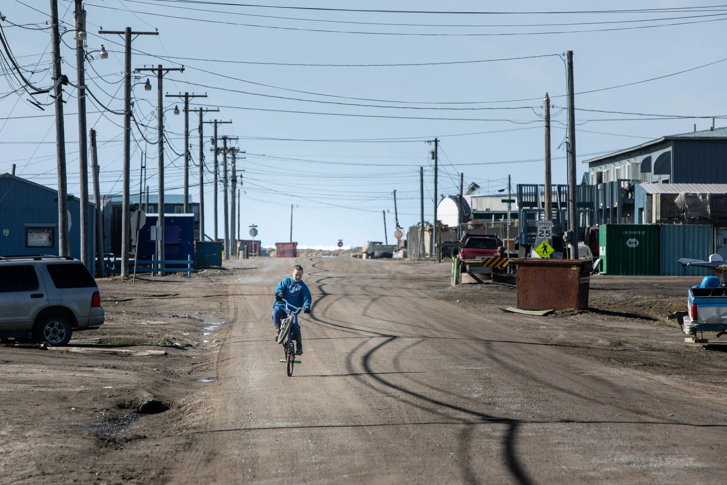 A child riding a bicycle in Utqiagvik.
